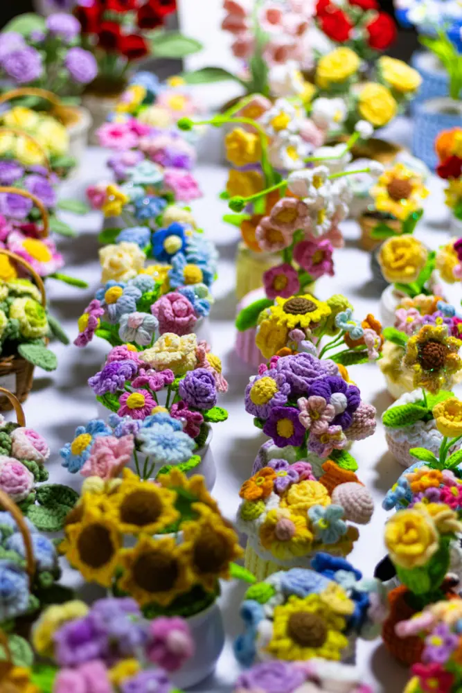 Colourful crochet flower pots arranged together